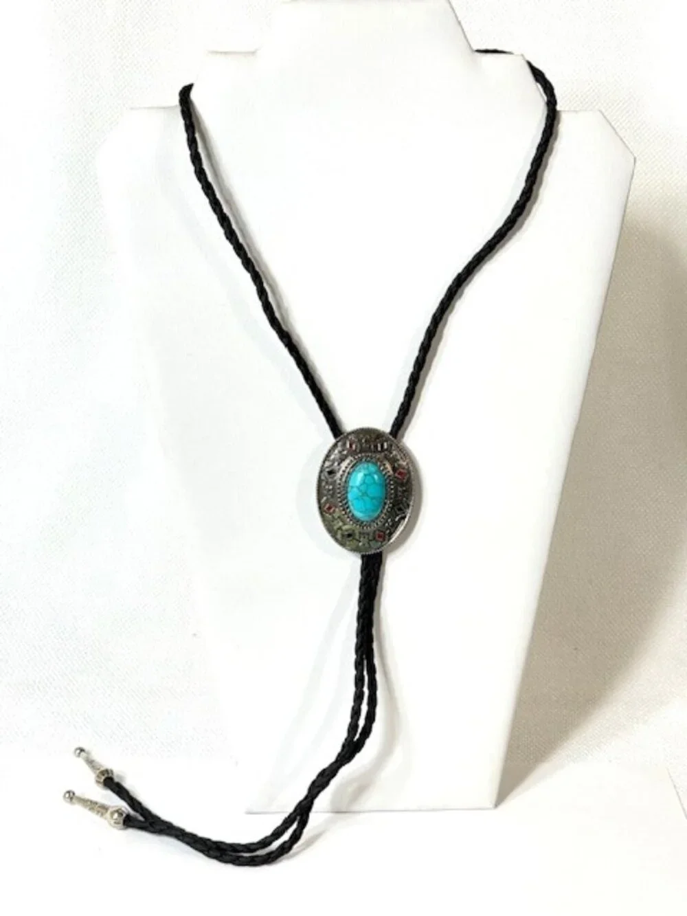 Turquoise-tone, silver-tone and black cord western cowboy bolo tie